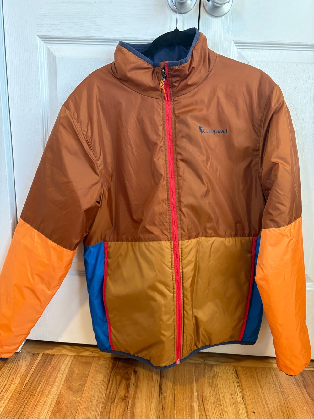 Cotopaxi Reversible Puffer Jacket in Brown, Orange & Blue